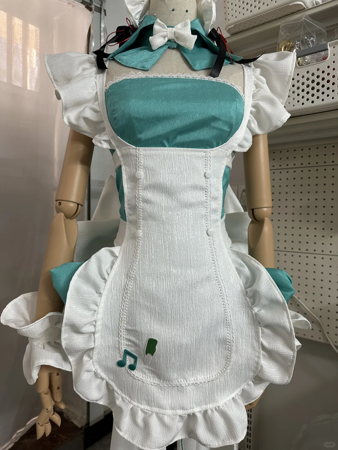 Elegant Teal and White Maid Dress with Ruffled Apron and Bow Details